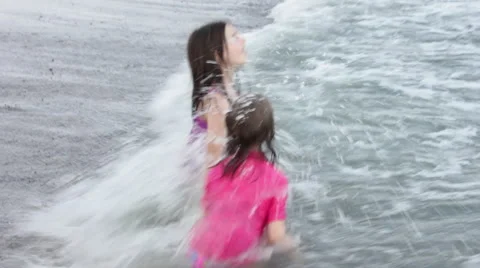 Kids Play in Waves  Stock Footage 58836518