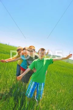 Kids play in wheat field Stock Photos