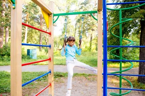 Kids on playground Stock Photos