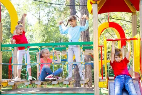 Kids on playground Stock Photos