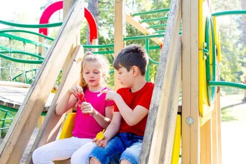 Kids on playground Stock Photos
