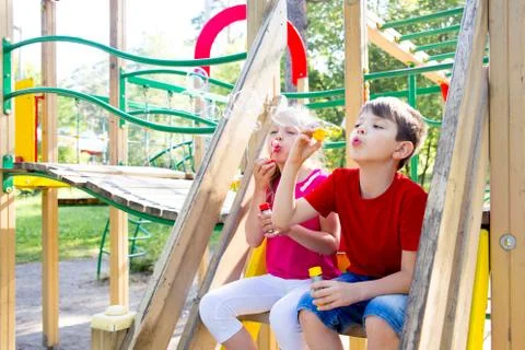 Kids on playground Stock Photos