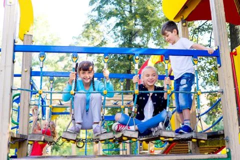 Kids on playground Stock Photos