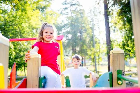 Kids on playground Stock Photos