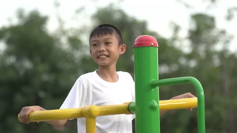 Kids playing and exercing on public outdoor gym park Stock-Footage 135543881