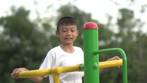 Kids playing and exercing on public outdoor gym park Stock-Footage 135543972