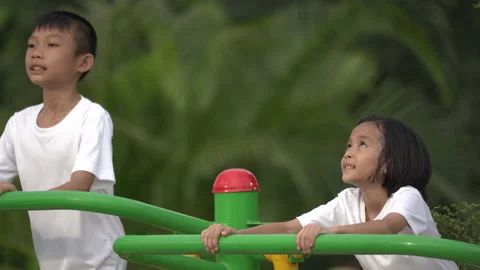Kids playing and exercing on public outdoor gym park Stock-Footage 135545359