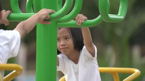 Kids playing and exercing on public outdoor gym park Stock-Footage 135546644