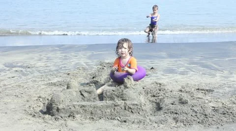 Kids playing on the beach Stock Footage 11630353