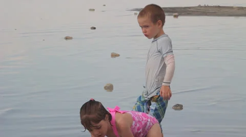 Kids playing on beach Stock Footage 27063236