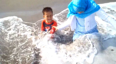 Kids Playing on the Beach Stock Footage 40859616