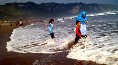 Kids Playing on the Beach Stock Footage 41060373