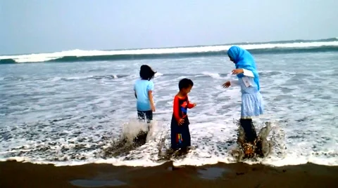 Kids Playing on the Beach Stock Footage 41060994
