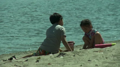 Kids playing on a beach. Stockbeeldmateriaal 52949830