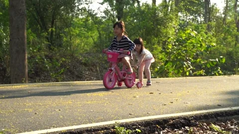 Kids playing bik Slomo2 Stock Footage 131873739