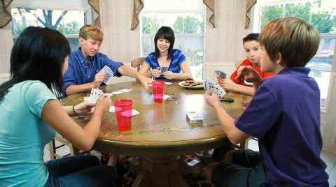Kids playing cards Stock Footage