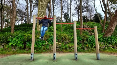 Kids playing on a climbing structure in a public park. Stock Footage 327685098