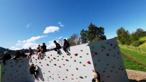 Kids Playing climbing the wall - Elementary School FPV Shooting Видео 284478769