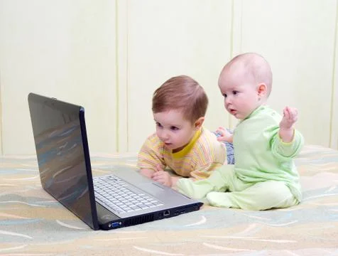 .kids playing computer games Stock Photos
