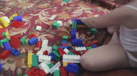 Kids playing constructor. Children playing with colorful plastic blocks. Stock Footage 63789126