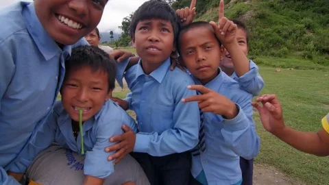 Kids playing in front of the camera Stock Footage 75887886