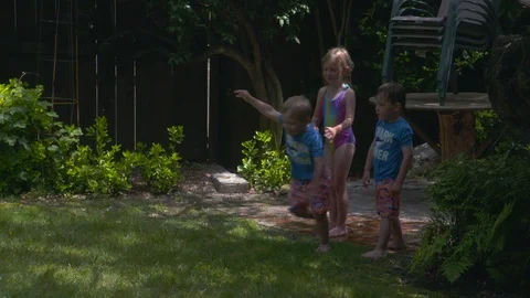 Kids playing in an inflatable pool Stock Footage 112944540