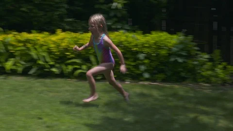 Kids playing in an inflatable pool Stock Footage 112944595