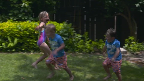 Kids playing in an inflatable pool Stock Footage 112945429