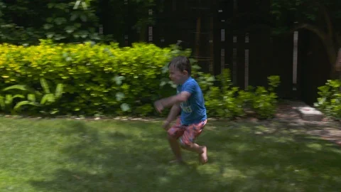 Kids playing in an inflatable pool Stock Footage 112945729
