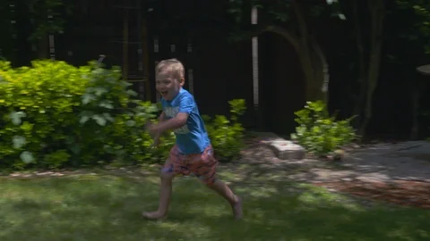 Kids playing in an inflatable pool 스톡 동영상 112946281