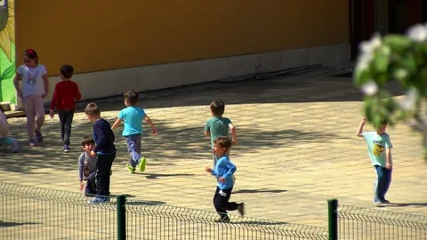Kids playing in kindergarten yard Stock Footage 88949085