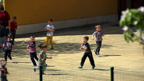 Kids playing in kindergarten yard Stock Footage 88949098