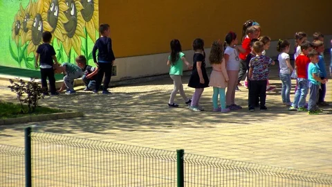 Kids playing in kindergarten yard Video stock 88949563