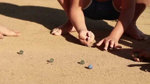 Kids playing marbles Stock-Footage 72080392