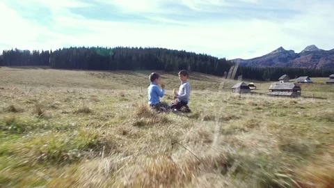 Kids playing on meadow Stock Footage 87085597