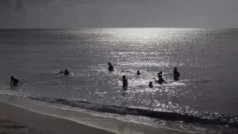 Kids playing in ocean Stock Footage 260578351