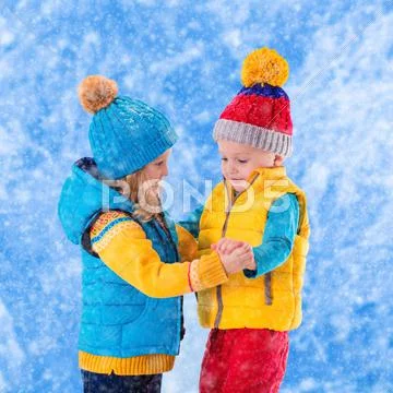 Kids playing outdoors in winter Stock Photos