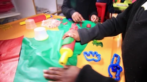 Kids playing with plasticine Stock Footage 43980747