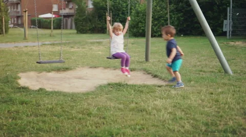 Kids Playing on Playground Stockbeeldmateriaal 53005475