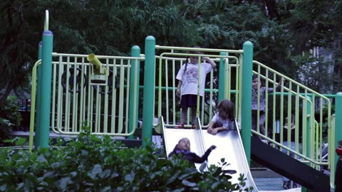 Kids playing on playground while wearing mask during holidays 库存影片 139883883