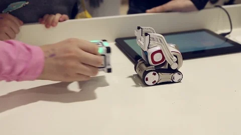Kids playing with robot Stock Footage 71480880
