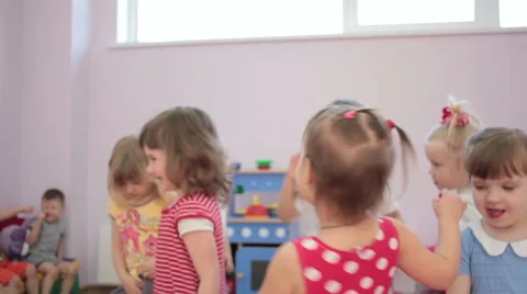 Kids playing running around dancing in kindergarten and laughter 스톡 동영상 62198882