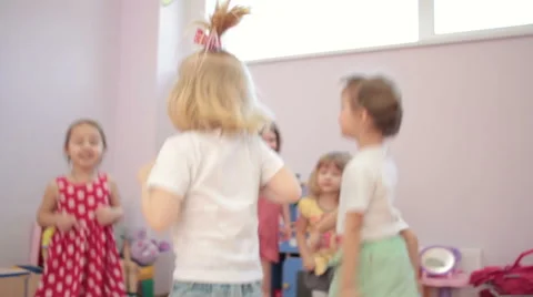 Kids playing running around dancing in kindergarten and laughter 스톡 동영상 62198939