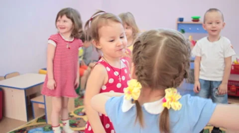 Kids playing running around dancing in kindergarten and laughter 스톡 동영상 62199026