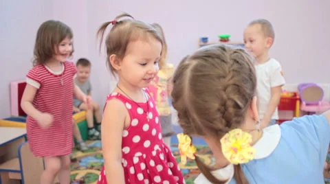 Kids playing running around dancing in kindergarten and laughter Stock Footage 62199065