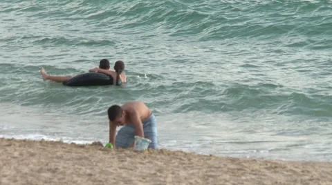 Kids playing in the sand Stock Footage 45490907
