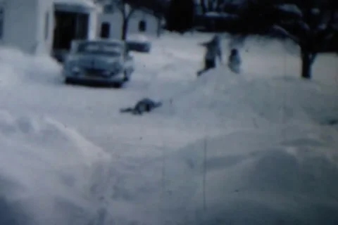 Kids playing in the snow Stock Footage 24672137