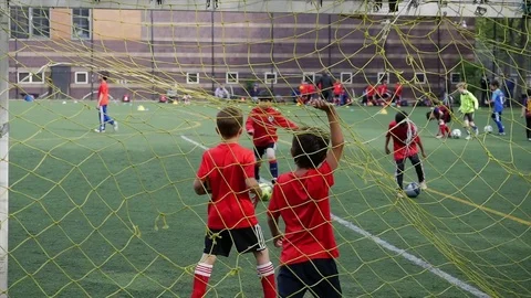 Kids playing soccer Stock Footage