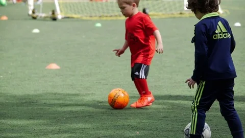 Kids playing soccer Stock Footage 77553200