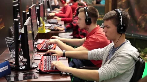 Kids playing video games in computer club Stock Footage 55456583